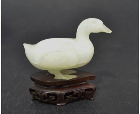 Chinese white jade box, carved as a standing goose, upon carved hard wood stand, 3.25"