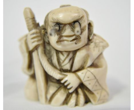 Japanese ivory Netsuke, carved as a sage, with pop-out eyes, signed to the base, height 1.5"