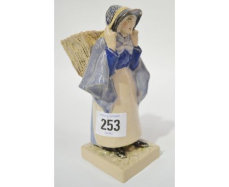 1920's Eric Bradbury pottery figure of a fish wife, carrying a basket on her back signed to the base and dated 1927, height 6