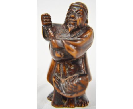 Japanese wood Netsuke carved as a fisherman, height 2"