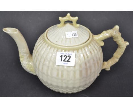 A Belleek porcelain teapot, seashell moulded with coral handle and finial, brown printed mark to the base, height 7" (chip to