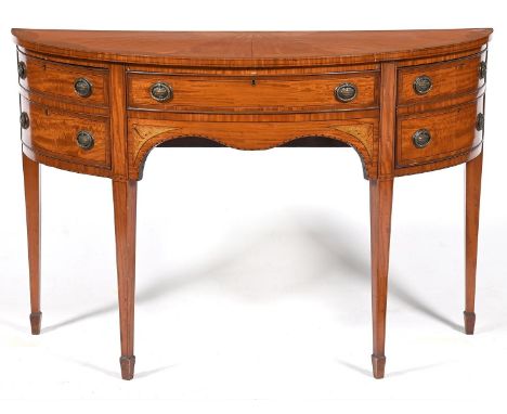 An Edwardian semi elliptical satinwood, rosewood, inlaid and penwork sideboard, the fan fluted top in matched veneers, sycamo