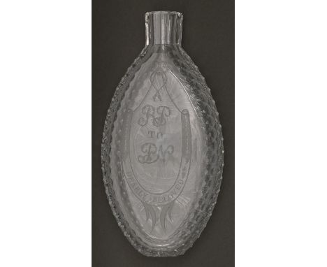 A Regency oval cut glass flask, engraved as a love token with horseshoe inscribed DEARLY BELOVED framing initials RP to PN, 1