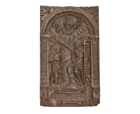 A Flemish oak ecclesiastical panel, 17th c,&nbsp;carved with the Baptism of Christ, within a scrolling architectural cartouch