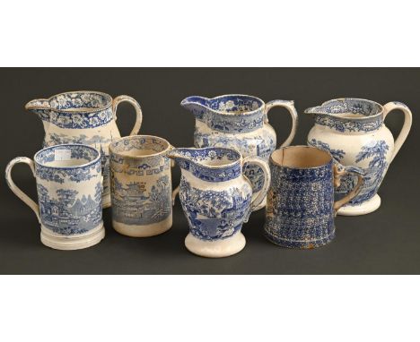 Seven blue and white transfer-printed earthenware and pearlware imperial measures, c.&nbsp;1820-40, quart and pint, jugs and 