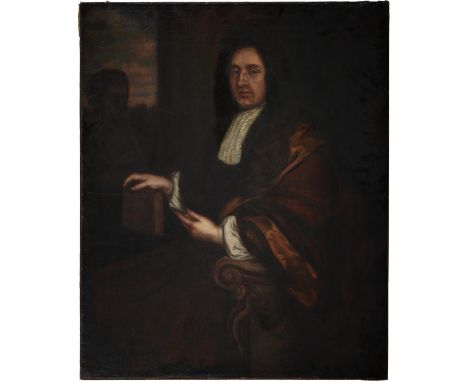 British School, 18th c - Portrait of a Man, three quarter length seated in a fur trimmed robe beside a bust and pointing to t