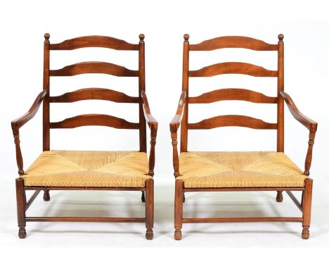 A pair of stained wood ladder back elbow chairs, late 20th c, in early 19th c style, rush seated, seat height 32cm  Good cond