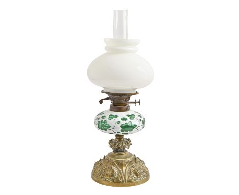 A Victorian stamped brass oil lamp, with white overlay green glass fount, Hink's &amp; Sons patent duplex burner, white glass