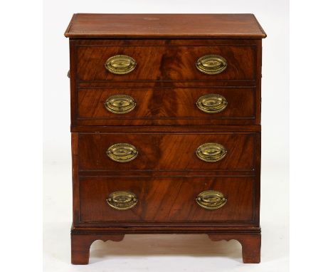 A George IV mahogany cupboard, adapted from a chest commode with later brass oval loop and cup handles, 76cm h; 47 x 64cm  Go
