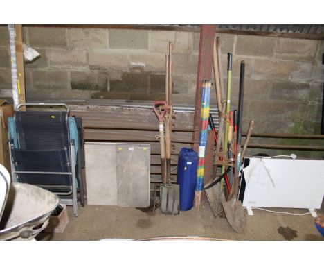 A quantity of long handled garden tools to include fork, spade, rake, hoe etc.