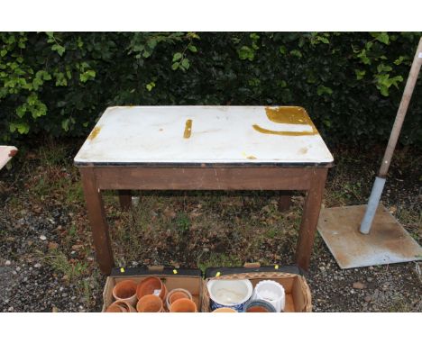 An enamel topped kitchen table with fitted drawer on one end 