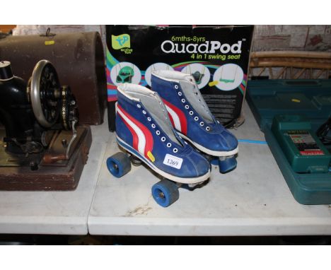 A pair of vintage Quad roller skates - lacking laces, size unknown 