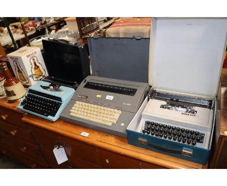 A Silver Reed typewriter; an Olivetti typewriter and a Corona word processor 