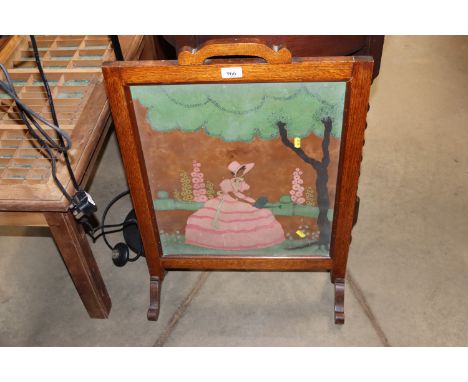 An oak framed fire screen 