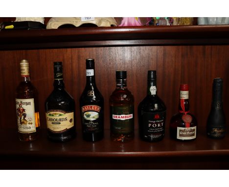 A bottle of Captain Morgan original spiced gold rum; a bottle of Drambuie; a bottle of port etc