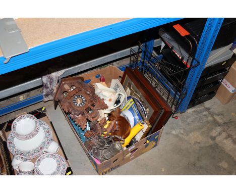 A box of various sundries to include Black Forest style cuckoo clock; framed prints; wire magazine rack etc