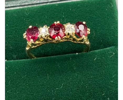 Antique 18ct yellow gold Ruby and diamond ring. Consists of 1 round and 2 oval cut rubies. and 2 round brilliant cut diamonds