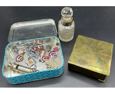 Arts and Crafts brass worked trinket box- marked HVB, Enamel badges, whistle, tin and perfume bottle with silver collar. 