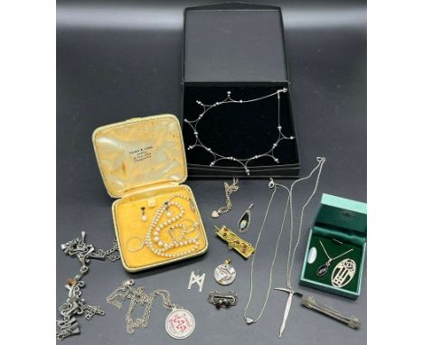 A Collection of silver jewellery to include Sheffield silver pick axe pendant and chain, Charles Horner thistle design brooch