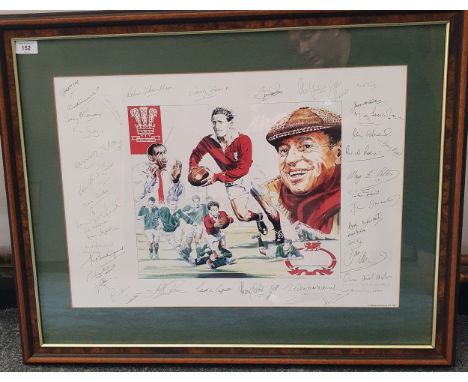 A Wooden Spoon Society Framed Print of the Welsh Rugby Team Showing Players in action conductor and presenter Dated 1998. All