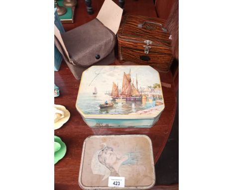 A lot of vintage tins together with a respirator and napkin rings 