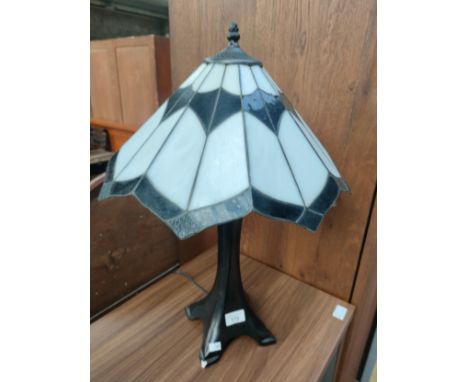 Tiffany style table lamp with shade . Small chip to base. 