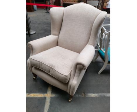 Vintage arm chair with brass caster feet 