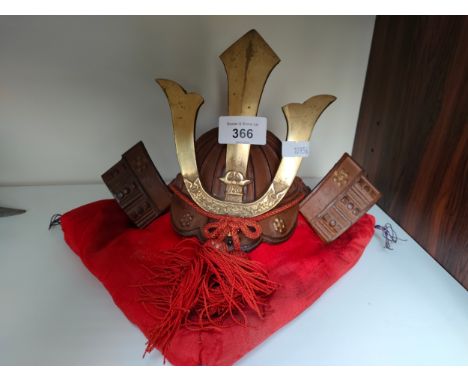 Oriental samurai warrior ornamental small display helmet and cushion. 