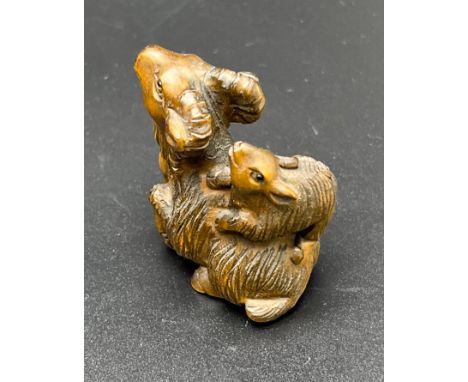 Hand carved Japanese Netsuke sculpture of a Mother Ram and baby on back. Signed. [4.5cm high] 