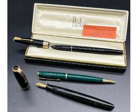 Three Vintage Parker Fountain pens and revolving pencil. Includes fountain pen with 14ct yellow gold nib. 