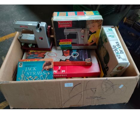 Large box of vintage games together with Vulcan sewing machine etc 