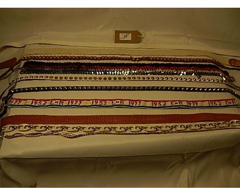 A collection of 10 Vintage belts C. 1970/80's to include a Elizabeth II 1977 Sliver Jubilee belt, Punk style studded belts, a