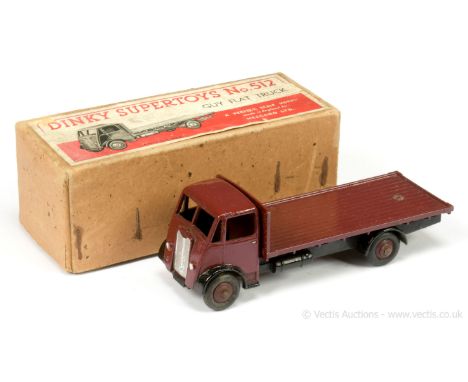 Dinky 512 Guy (type 1) Flat Truck - maroon cab, back &amp; ridged hubs with smooth tyres, black chassis, silver trim, with to