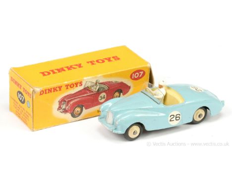 Dinky 107 Sunbeam Alpine Sports Car - light blue, cream interior with figure driver, silver trim, light beige ridged hubs wit