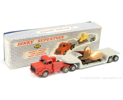 Dinky 986 Mighty Antar Low Loader with Propeller Load - finished in red unit with grey Supertoy hubs, black grille, light blu