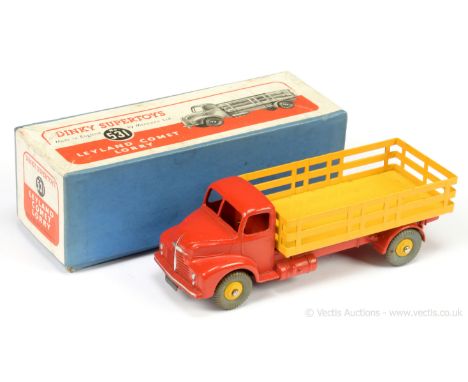 Dinky 531 Leyland Comet Lorry - red cab and chassis, yellow stake back and ridged hubs with grey treaded tyres, metal tow hoo