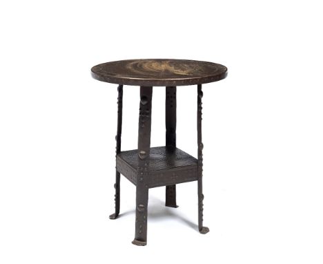 Arts &amp; Crafts Metal side table hammered and embossed decoration, round top over single shelf. 50cm across, 63cm high 