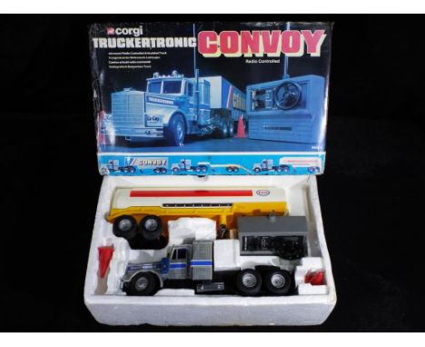 Corgi - A boxed Corgi M5600 Convoy Truckertronic battery operated remote control Truck. A large scale plastic silver truck wi