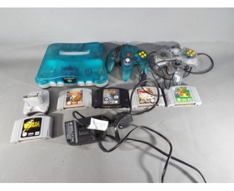 Nintendo - A Nintendo N64 games console, two controllers, Nintendo 64 Transfer Pak and a quantity of game cartridges to inclu