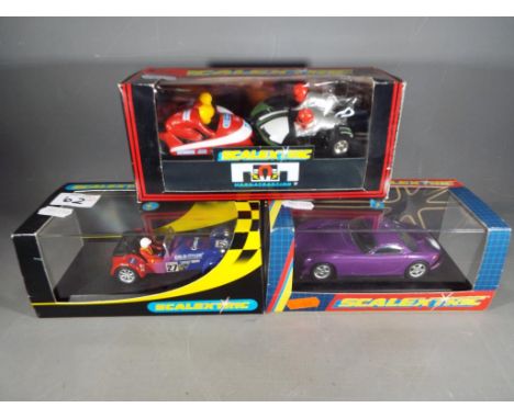 Scalextric - a Scalextric Subaru Impreza #C2256, TRV purple #2194 and two further Scalextric vehicles to include a motorbike 