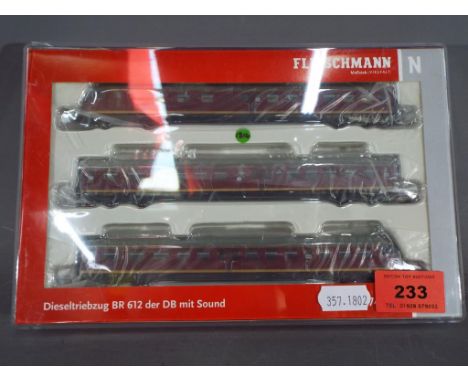 Fleischmann - A Fleischmann N gauge three unit Diesel rail coach series 612 of the DB, epoch IV, # 741272. Model appears M in