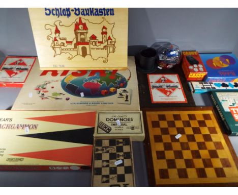 A quantity of vintage games to include Backgammon, Risk, Scrabble, Monopoly, Chess, Dominoes, Schlob Baukasten and similar.