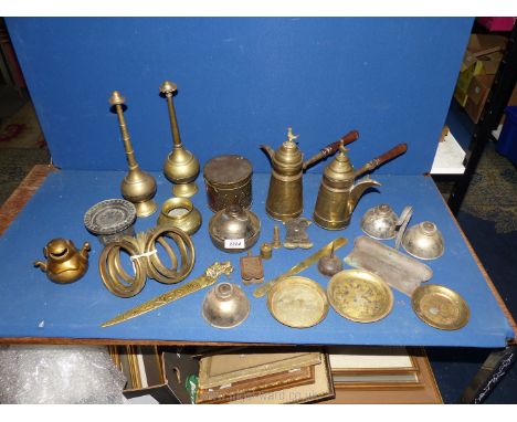 A quantity of brass including Eastern style coffee pots, pot pourri, curtain rings, lamp bases, page turner, etc.