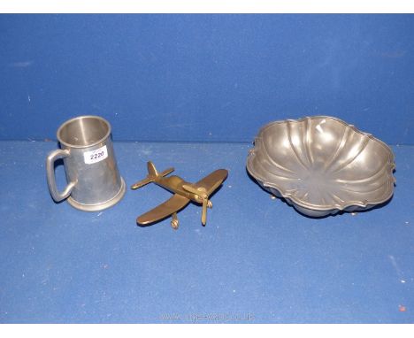 A brass model war plane, Pewter bowl and tankard.