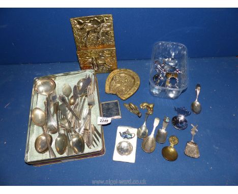 A quantity of souvenir caddy spoons, cutlery (including Venetian silver spoons) and a small quantity of brass including ashtr