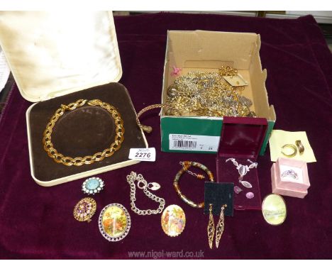 A quantity of costume jewellery including bracelets, earrings, brooches etc.