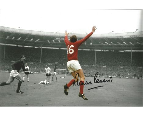 Football Martin Peters signed 12x8 colourised photo pictured celebrating after scoring in the 1966 World Cup Final. Good cond