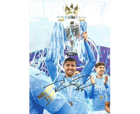 Football Ruben Dias signed 12x8 colour photo pictured celebrating with the Premier league trophy for Manchester City. Ruben d