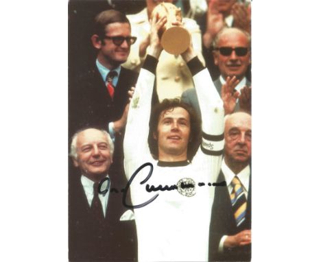 Football Franz Beckenbauer signed 6x4 colour photo pictured lifting the World Cup for Germany in 1974. Good condition. All au