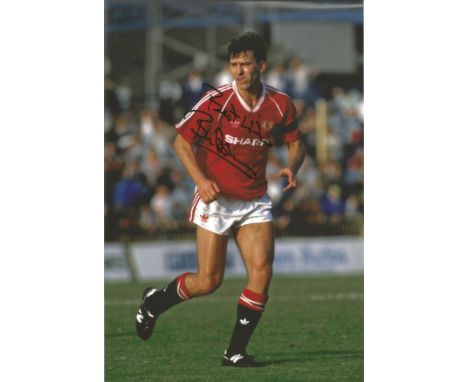 Football Bryan Robson signed 12x8 colour photo pictured in action for Manchester United. Bryan Robson OBE , born 11 January 1